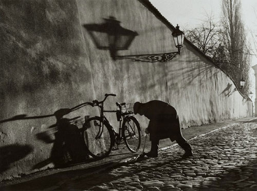 Untitled (Man Repairing Bicycle tire)